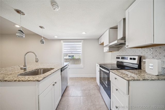 241 S Richmond Ave, Tulsa, OK 74112 - kitchen featuring appliances with stainless steel finishes, wall chimney range hood, white cabinets, decorative backsplash, and light stone countertops