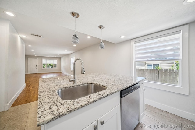 241 S Richmond Ave, Tulsa, OK 74112 - kitchen featuring dishwasher, open floor plan, white cabinetry, hanging light fixtures, and light stone countertops