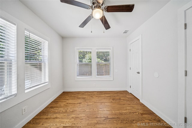 241 S Richmond Ave, Tulsa, OK 74112 - empty room with wood finished floors and ceiling fan