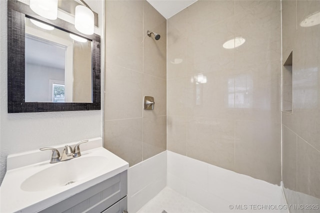 241 S Richmond Ave, Tulsa, OK 74112 - bathroom featuring vanity and a tile shower