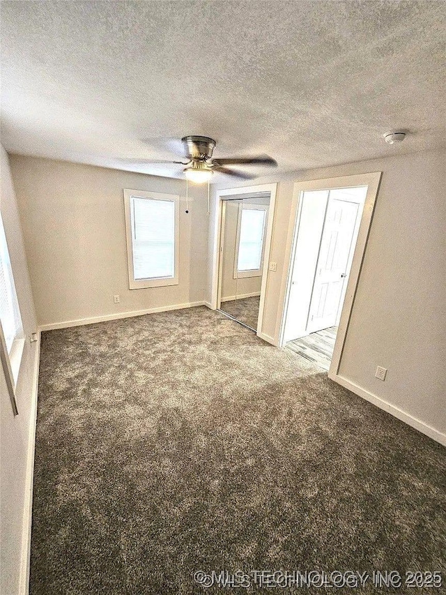 241 S Richmond Ave, Tulsa, OK 74112 - unfurnished bedroom with carpet flooring, a textured ceiling, and a ceiling fan