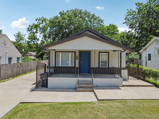241 S Richmond Ave, Tulsa, OK 74112 - bungalow-style home featuring stucco siding and a porch