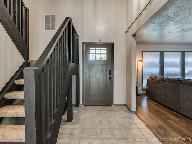 6708 S 5th St, Broken Arrow, OK 74011 - tiled foyer entrance with stairway and a towering ceiling