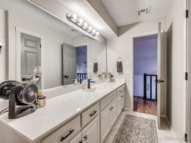 6708 S 5th St, Broken Arrow, OK 74011 - full bathroom with vanity and a textured ceiling