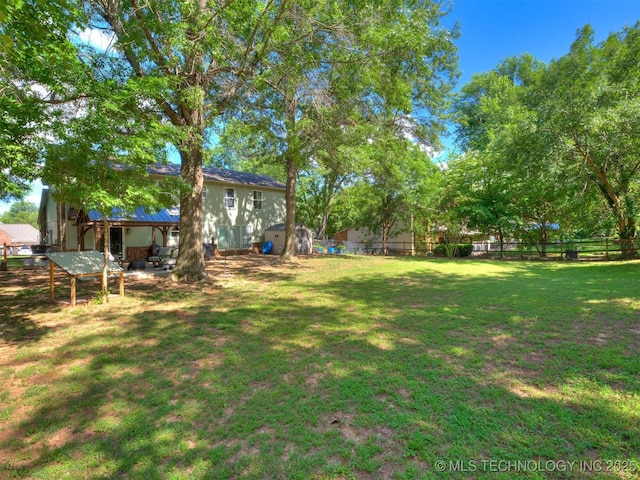 6708 S 5th St, Broken Arrow, OK 74011 - view of yard featuring a storage unit