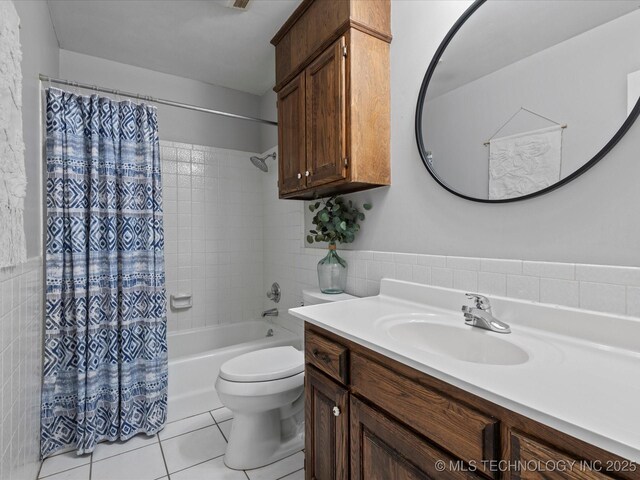 6725 Dorsett Dr, Bartlesville, OK 74006 - full bathroom featuring tile walls, vanity, tile patterned floors, and shower / bath combo