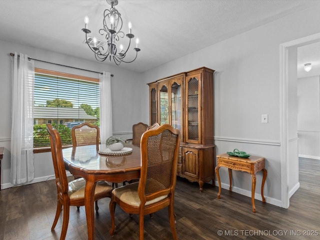 6725 Dorsett Dr, Bartlesville, OK 74006 - dining room with a chandelier and dark wood-style floors