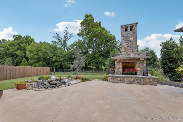 11029 S Kennedy St, Jenks, OK 74037 - view of patio / terrace with an outdoor stone fireplace