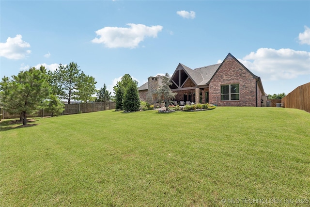 11029 S Kennedy St, Jenks, OK 74037 - view of front facade featuring a fenced backyard and brick siding
