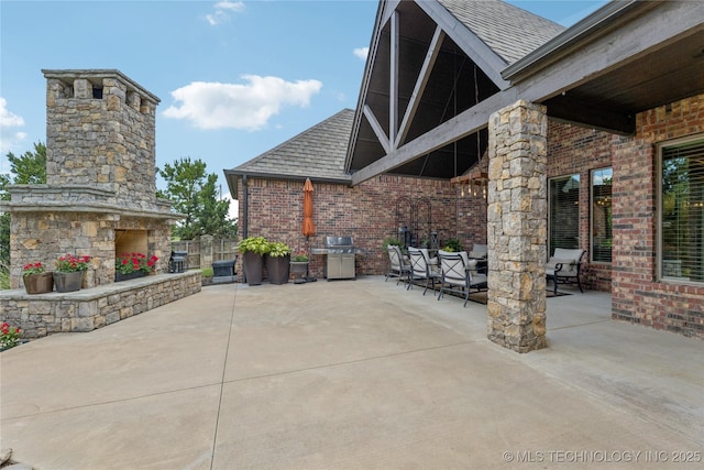 11029 S Kennedy St, Jenks, OK 74037 - view of patio / terrace featuring an outdoor stone fireplace and area for grilling