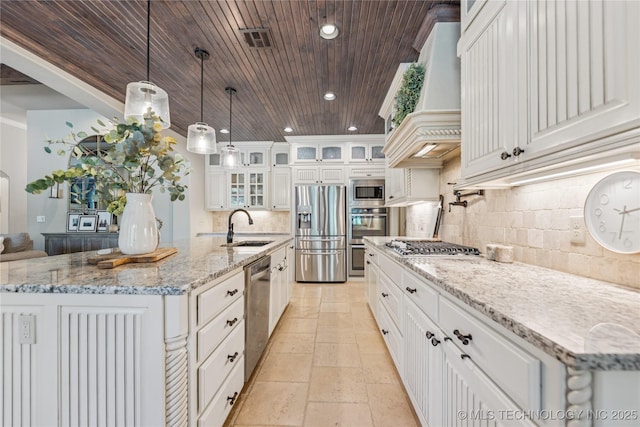 11029 S Kennedy St, Jenks, OK 74037 - kitchen with stainless steel appliances, custom range hood, backsplash, wood ceiling, and decorative light fixtures