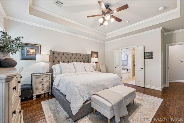 11029 S Kennedy St, Jenks, OK 74037 - bedroom featuring a tray ceiling, wood finished floors, ornamental molding, connected bathroom, and a ceiling fan