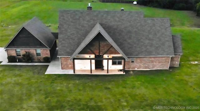 6865 Wilson St, Durant, OK 74701 - back of property featuring a patio area and a yard