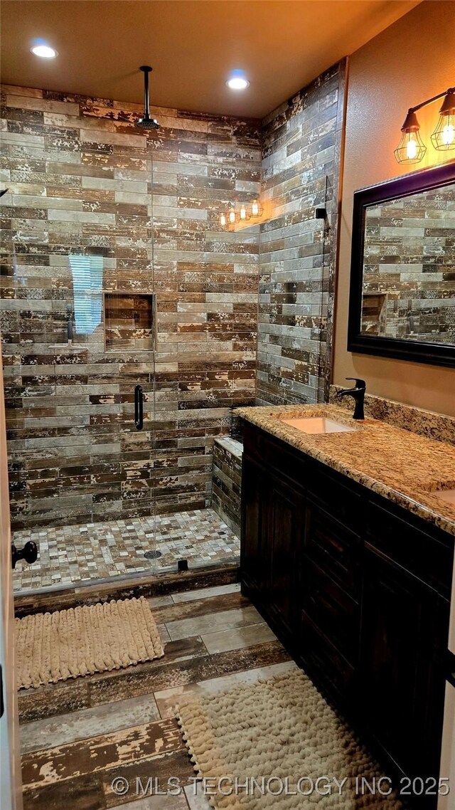 6865 Wilson St, Durant, OK 74701 - bathroom featuring a stall shower, double vanity, and recessed lighting