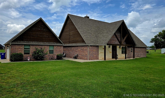 6865 Wilson St, Durant, OK 74701 - view of front facade featuring a patio area, a front yard, a shingled roof, and a chimney