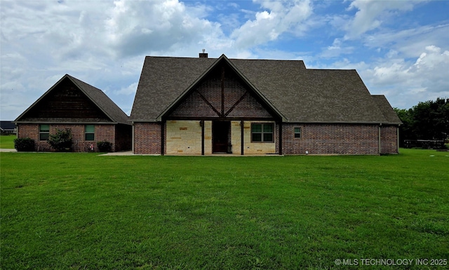 6865 Wilson St, Durant, OK 74701 - view of front of property with a front lawn, brick siding, and a shingled roof