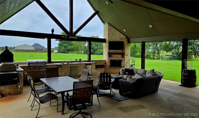 6865 Wilson St, Durant, OK 74701 - view of patio featuring an outdoor living space with a fireplace, exterior kitchen, and outdoor dining space
