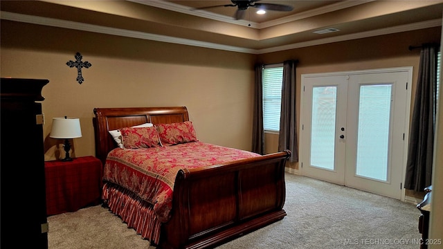 6865 Wilson St, Durant, OK 74701 - carpeted bedroom with access to outside, french doors, ornamental molding, a tray ceiling, and ceiling fan
