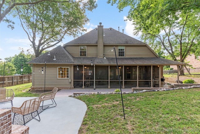 12511 S 18th Cir E, Jenks, OK 74037 - back of property featuring a sunroom, a patio area, roof with shingles, and a chimney