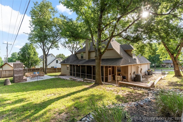 12511 S 18th Cir E, Jenks, OK 74037 - rear view of property featuring a sunroom, a patio area, a fenced backyard, and a shingled roof