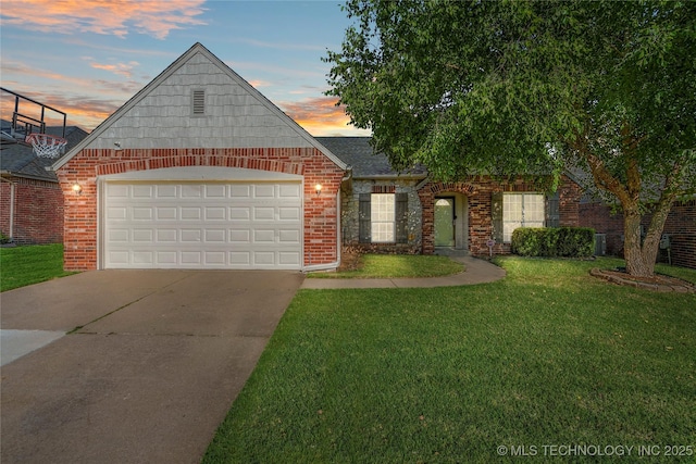 12522 S Cedar Ave, Jenks, OK 74037 - view of front facade with brick siding, a yard, driveway, and a garage