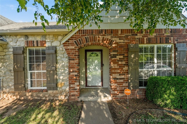 12522 S Cedar Ave, Jenks, OK 74037 - property entrance featuring brick siding and a shingled roof