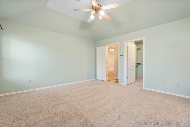 12522 S Cedar Ave, Jenks, OK 74037 - unfurnished bedroom with vaulted ceiling, light colored carpet, a spacious closet, a closet, and ceiling fan