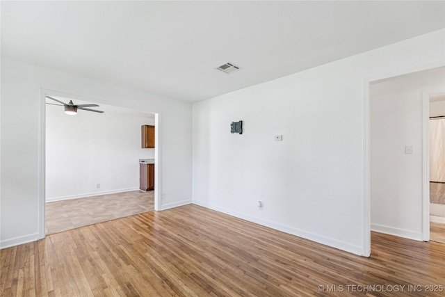 2127 W 48th Pl, Tulsa, OK 74107 - empty room with a ceiling fan and light wood finished floors