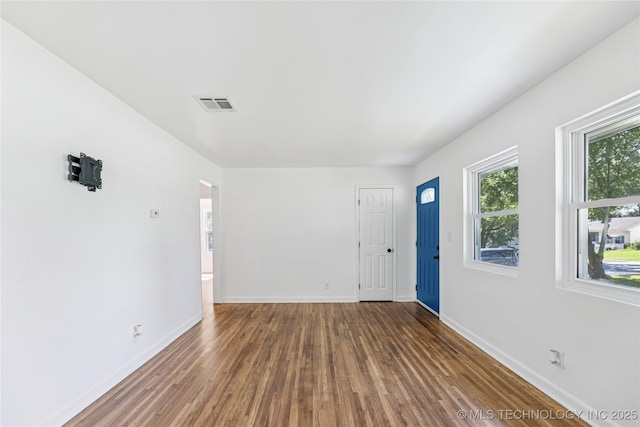 2127 W 48th Pl, Tulsa, OK 74107 - spare room featuring wood finished floors and baseboards