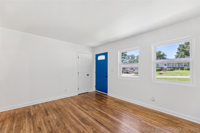 2127 W 48th Pl, Tulsa, OK 74107 - entryway with baseboards and wood finished floors