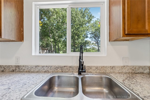 2127 W 48th Pl, Tulsa, OK 74107 - kitchen view of brown cabinets and light stone counters