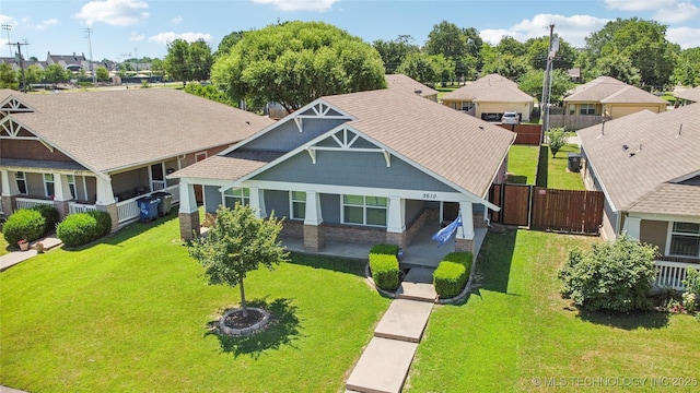 2610 E 5th Pl, Tulsa, OK 74104 - view of front of house with a residential view and a shingled roof