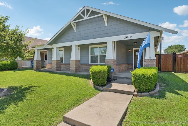 2610 E 5th Pl, Tulsa, OK 74104 - craftsman-style house featuring brick siding and covered porch
