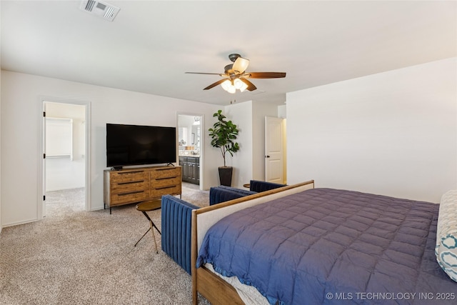 2610 E 5th Pl, Tulsa, OK 74104 - carpeted bedroom featuring a ceiling fan and ensuite bath