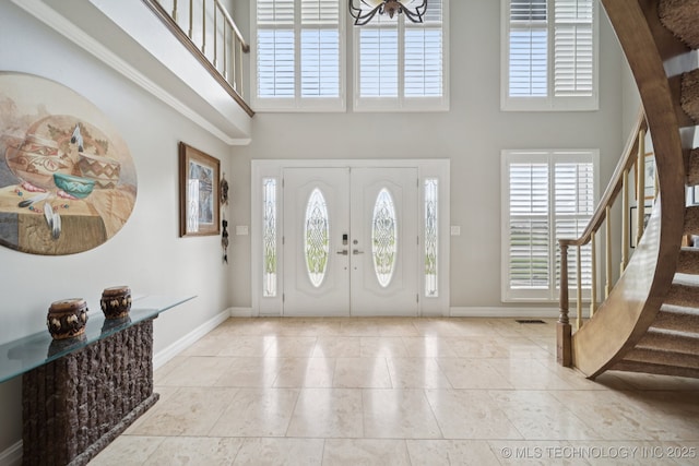 8120 E 112th St, Owasso, OK 74055 - entryway featuring a towering ceiling, stairs, healthy amount of natural light, and tile patterned floors