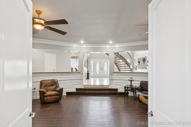 8120 E 112th St, Owasso, OK 74055 - foyer with ornamental molding, a decorative wall, ceiling fan, stairway, and wood finished floors