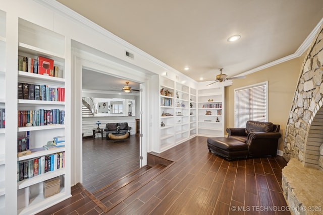 8120 E 112th St, Owasso, OK 74055 - living area featuring a ceiling fan, ornamental molding, dark wood-style floors, recessed lighting, and built in shelves