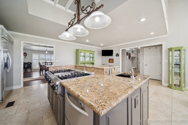 8120 E 112th St, Owasso, OK 74055 - kitchen featuring crown molding, an island with sink, light stone counters, stainless steel appliances, and recessed lighting