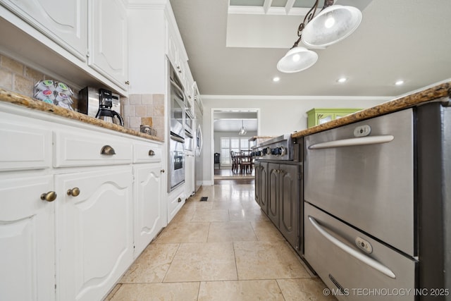 8120 E 112th St, Owasso, OK 74055 - kitchen with white cabinets, appliances with stainless steel finishes, light tile patterned flooring, recessed lighting, and crown molding