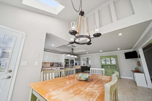 8120 E 112th St, Owasso, OK 74055 - dining room featuring a chandelier, a skylight, recessed lighting, ornamental molding, and a raised ceiling