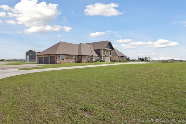 8120 E 112th St, Owasso, OK 74055 - view of front of house with driveway, a front lawn, and an attached garage