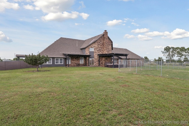 8120 E 112th St, Owasso, OK 74055 - back of house with a pergola, a fenced backyard, and stone siding
