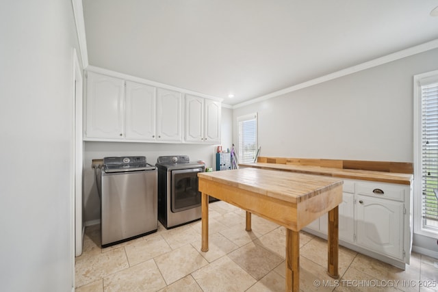 8120 E 112th St, Owasso, OK 74055 - laundry room featuring cabinet space, independent washer and dryer, crown molding, healthy amount of natural light, and light tile patterned floors