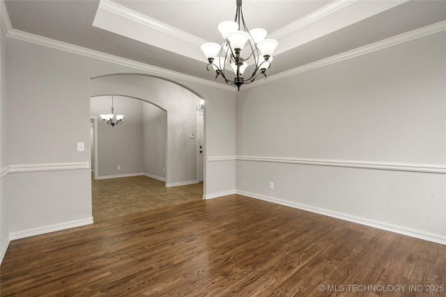 3712 W 107th Ct, Jenks, OK 74037 - empty room featuring a chandelier, arched walkways, wood finished floors, ornamental molding, and a raised ceiling