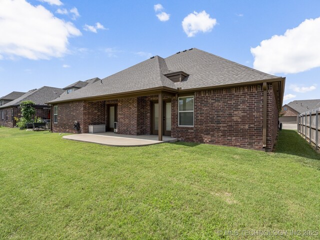 3712 W 107th Ct, Jenks, OK 74037 - back of house featuring brick siding, a patio, and a shingled roof