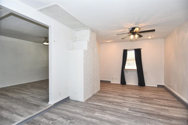 20529 E 4th St, Tulsa, OK 74108 - empty room featuring attic access, a ceiling fan, and wood finished floors