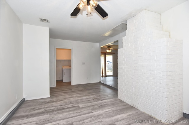 20529 E 4th St, Tulsa, OK 74108 - empty room with washer / dryer, ceiling fan, and wood finished floors