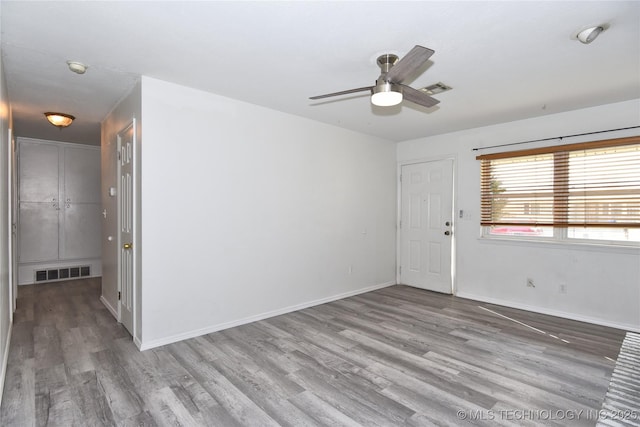 20529 E 4th St, Tulsa, OK 74108 - empty room with wood finished floors, a ceiling fan, and a smoke detector