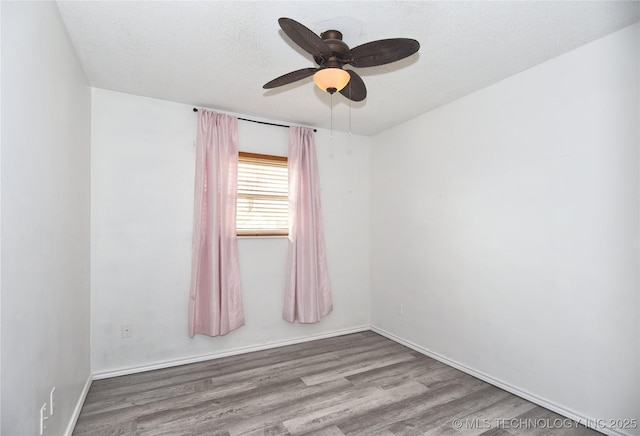 20529 E 4th St, Tulsa, OK 74108 - unfurnished room with wood finished floors, ceiling fan, and a textured ceiling