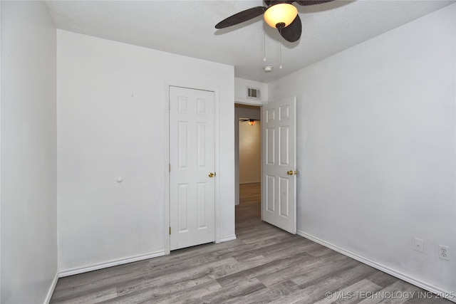 20529 E 4th St, Tulsa, OK 74108 - unfurnished bedroom featuring wood finished floors and ceiling fan